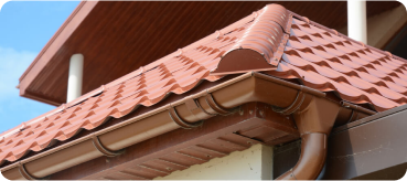 tiled roof against blue sky with clouds idea background with space text ecofriendly traditional roofs home 1 - Top Tejados Cáceres‎